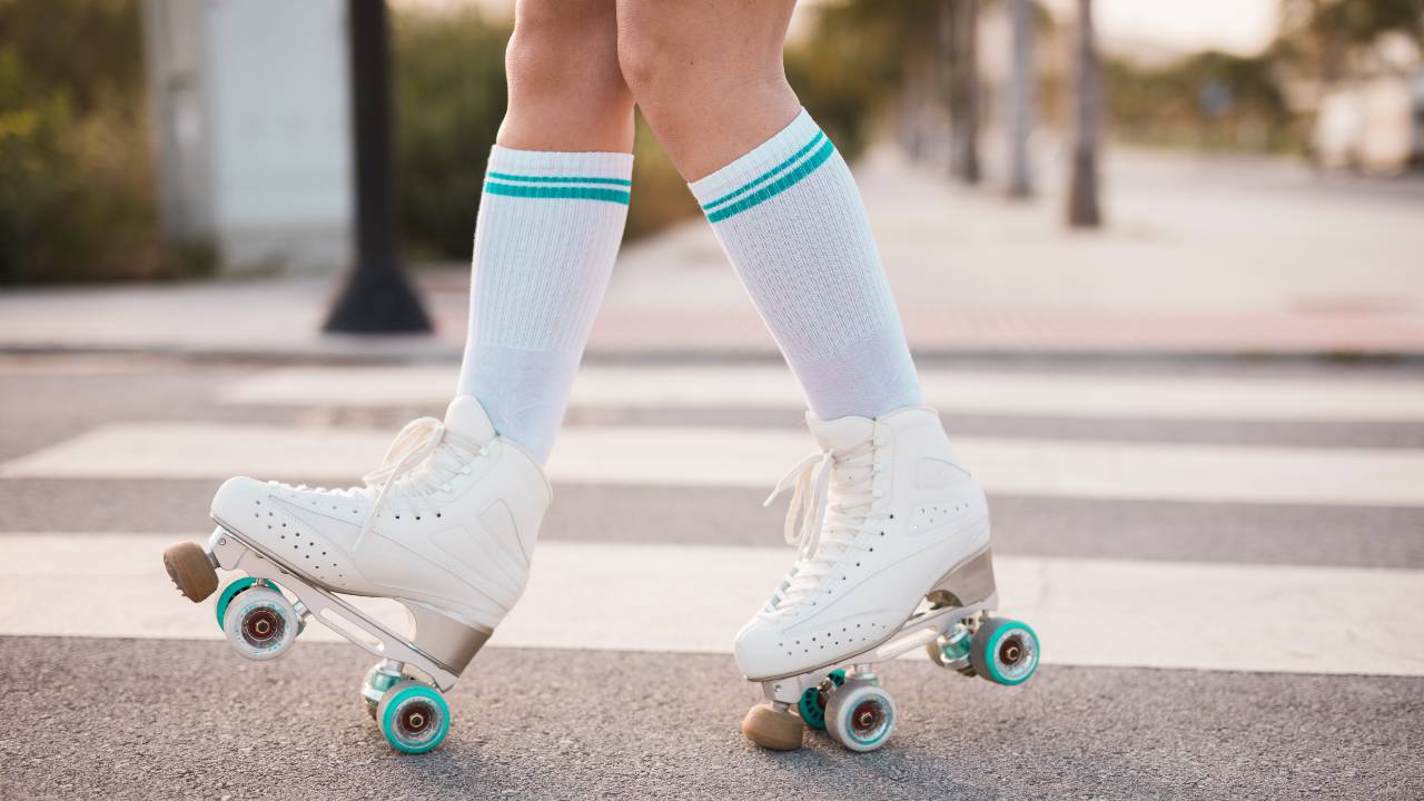 low-section-of-woman-wearing-vintage-roller-skate-walking-on-road (1)